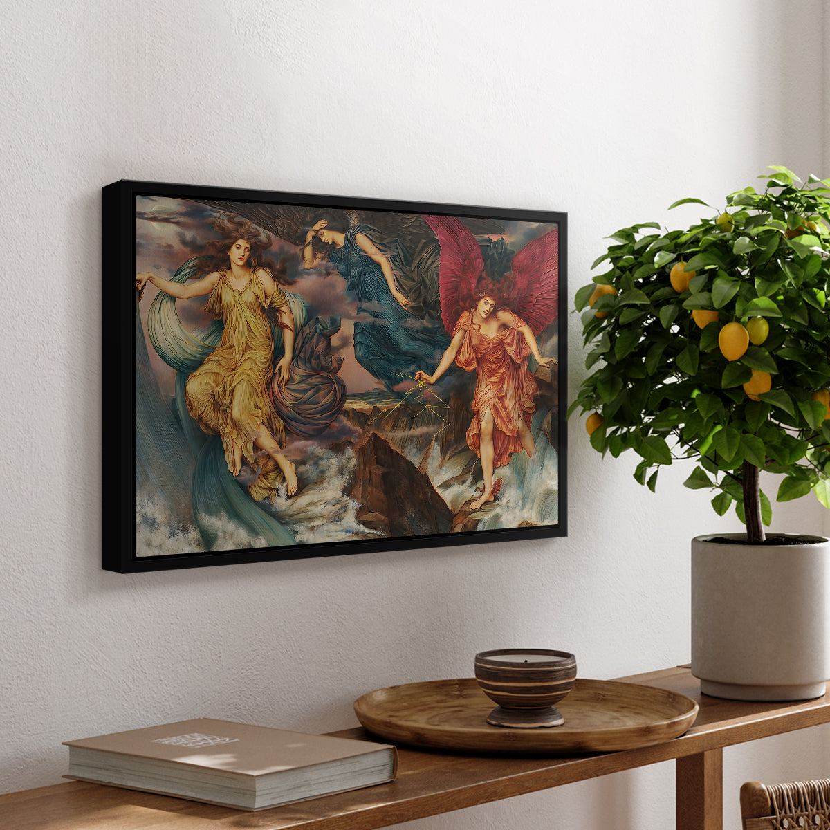 The Storm Spirits, 1900 by Evelyn De Morgan, presented in a black floater framed canvas featuring multiple figures swirling through sky representing storm forces in motion, displayed above a hallway console table.