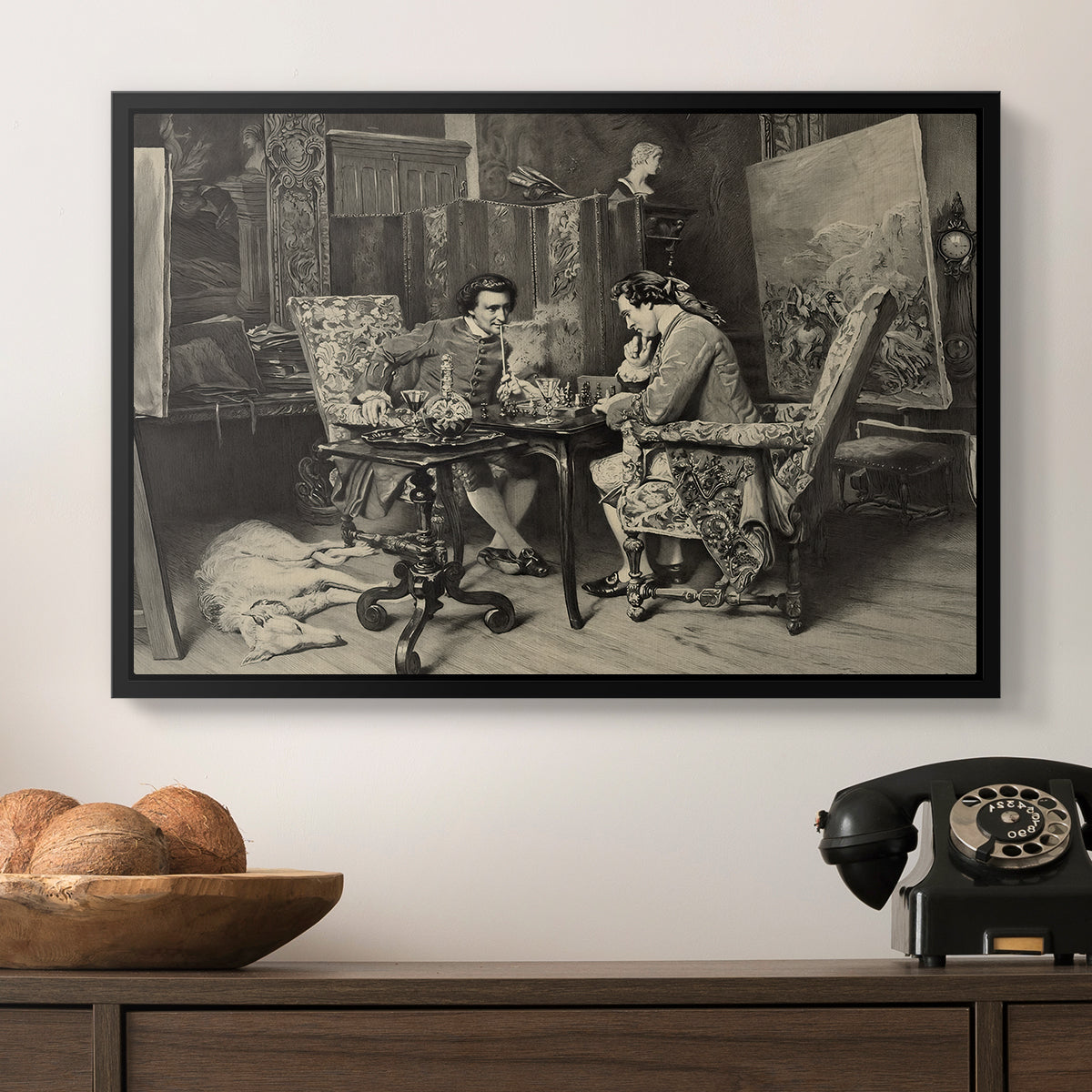 The Chess Players, 1858 by Ernest Meissonier in a black floater framed canvas displayed above a console table in a hallway, featuring a monochrome-style depiction of strategic game between two figures.
