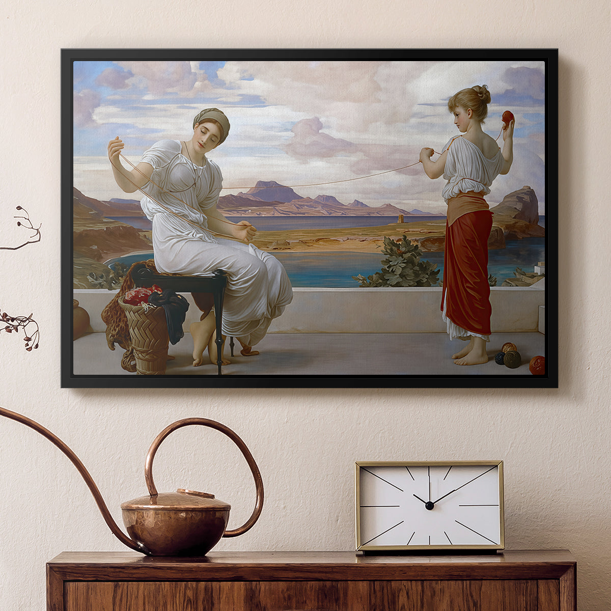 Black floater framed canvas featuring a classical scene of figures winding thread together, displayed above a cabinet in a soft-toned living room.