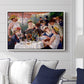 Luncheon of the Boating Party (Le Déjeuner des canotiers), 1880-1881 by Pierre-Auguste Renoir displayed above a sofa in a living room in a white floater frame, featuring a lively gathering of men and women eating and socializing at outdoor table.