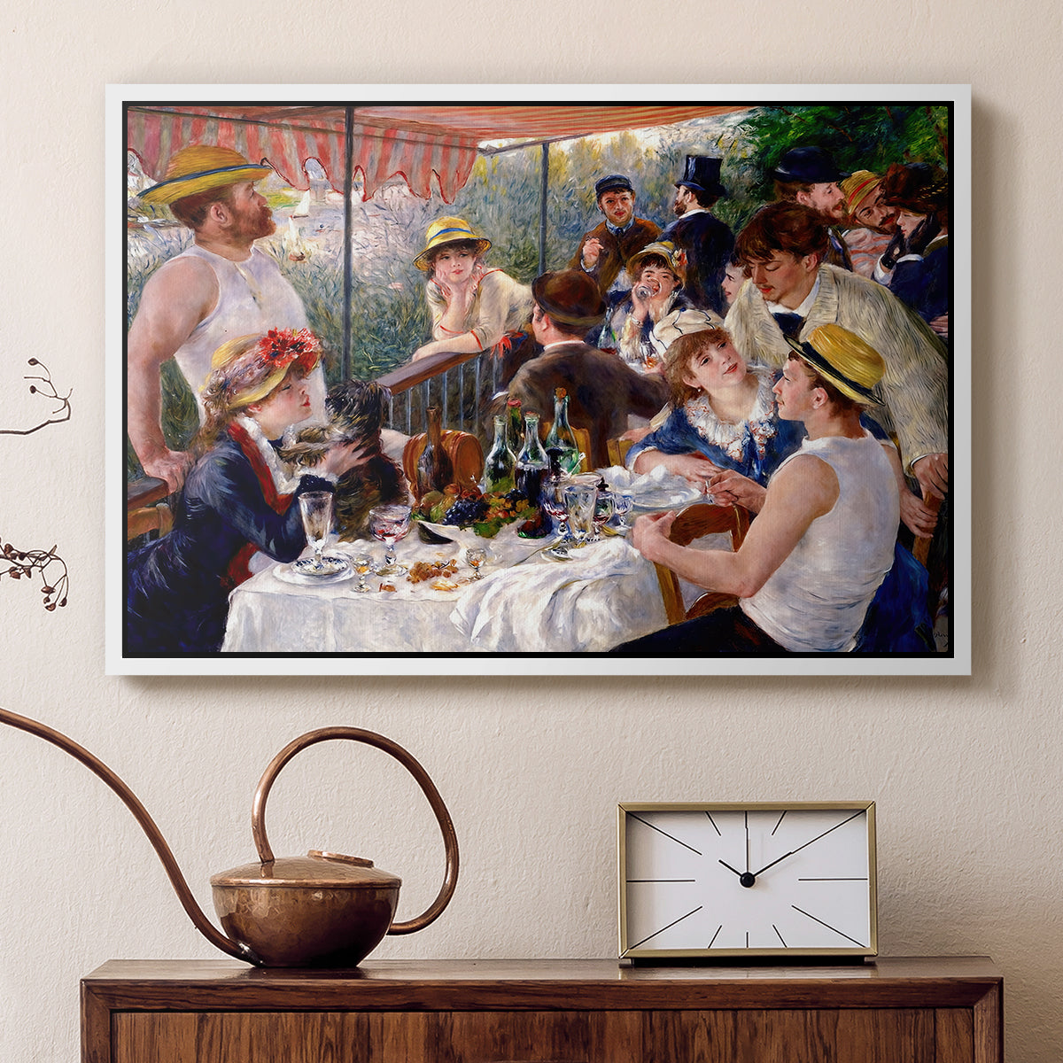 White floater framed canvas featuring an impressionist scene of friends enjoying lunch with wine and conversation, displayed above a cabinet in a soft-toned living room.