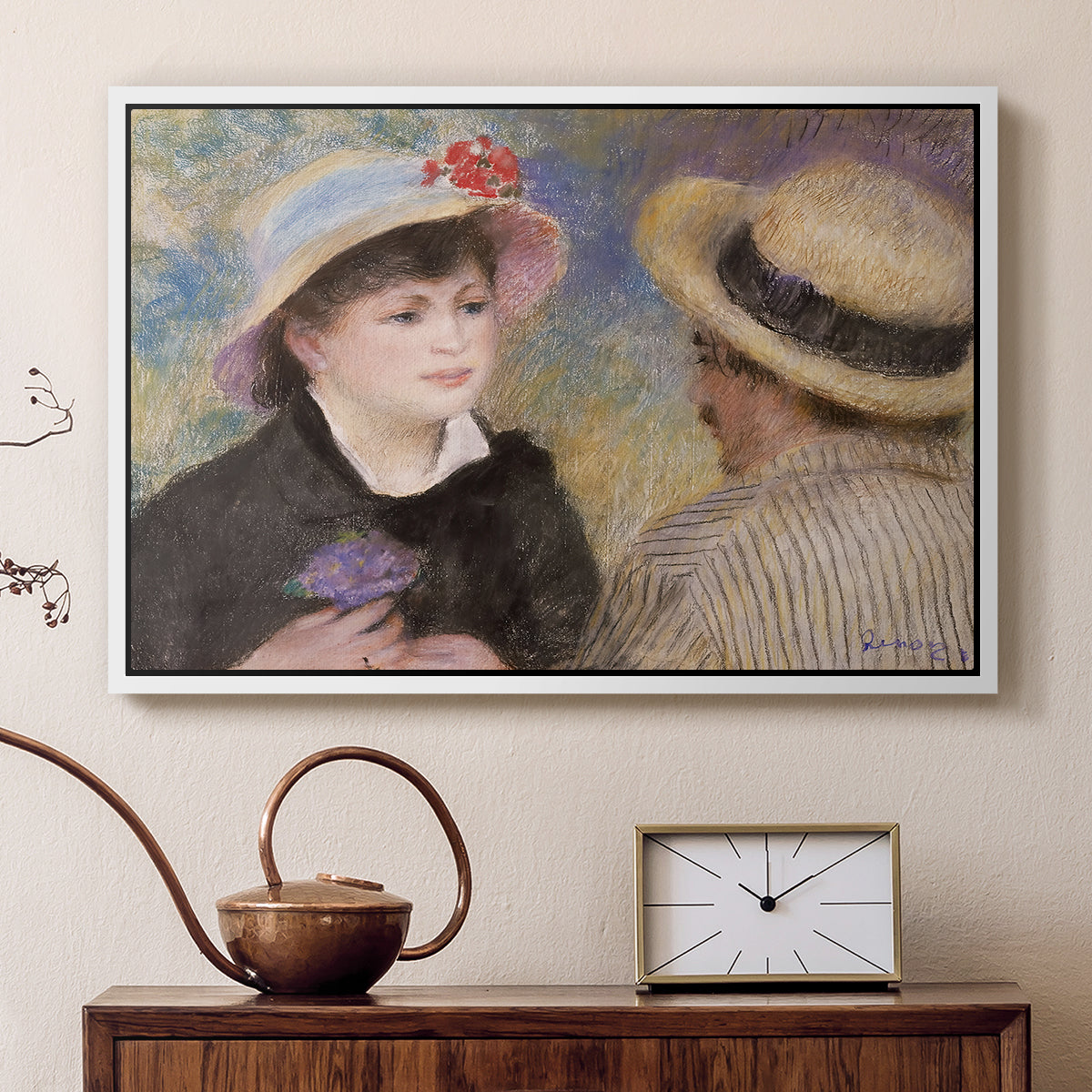 White floater framed canvas featuring an impressionist depiction of couple enjoying leisure time near water, displayed above a cabinet in a soft-toned living room.