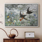 White floater framed canvas featuring a multiple birds flying together in natural outdoor scene, displayed above a cabinet in a soft-toned living room.