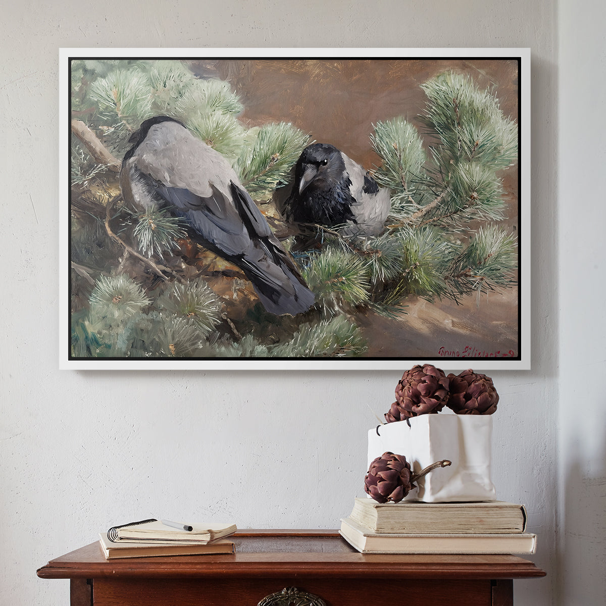 White floater framed canvas featuring Hooded Crows (Kråkor), 1891 by Bruno Liljefors above an entryway table in a minimalist foyer.