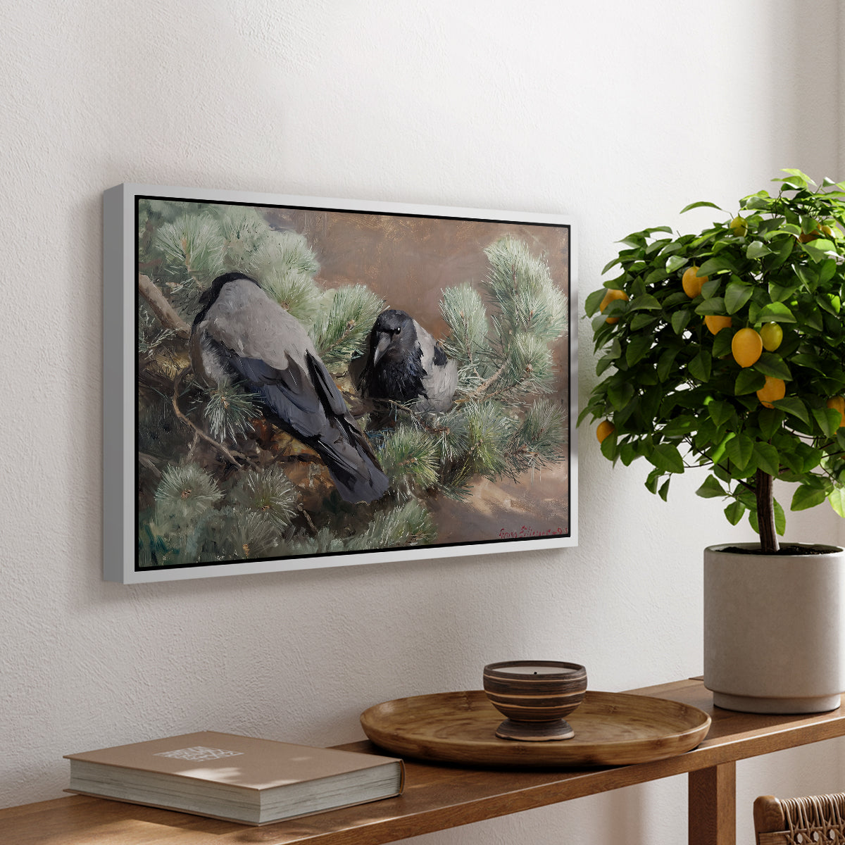 Hooded Crows (Kråkor), 1891 by Bruno Liljefors, presented in a white floater framed canvas featuring two crows perched on ground among grass and earth tones, displayed above a hallway console table.
