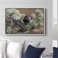 Hooded Crows (Kråkor), 1891 by Bruno Liljefors displayed above a sofa in a living room in a white floater frame, featuring birds standing alert in natural field environment.