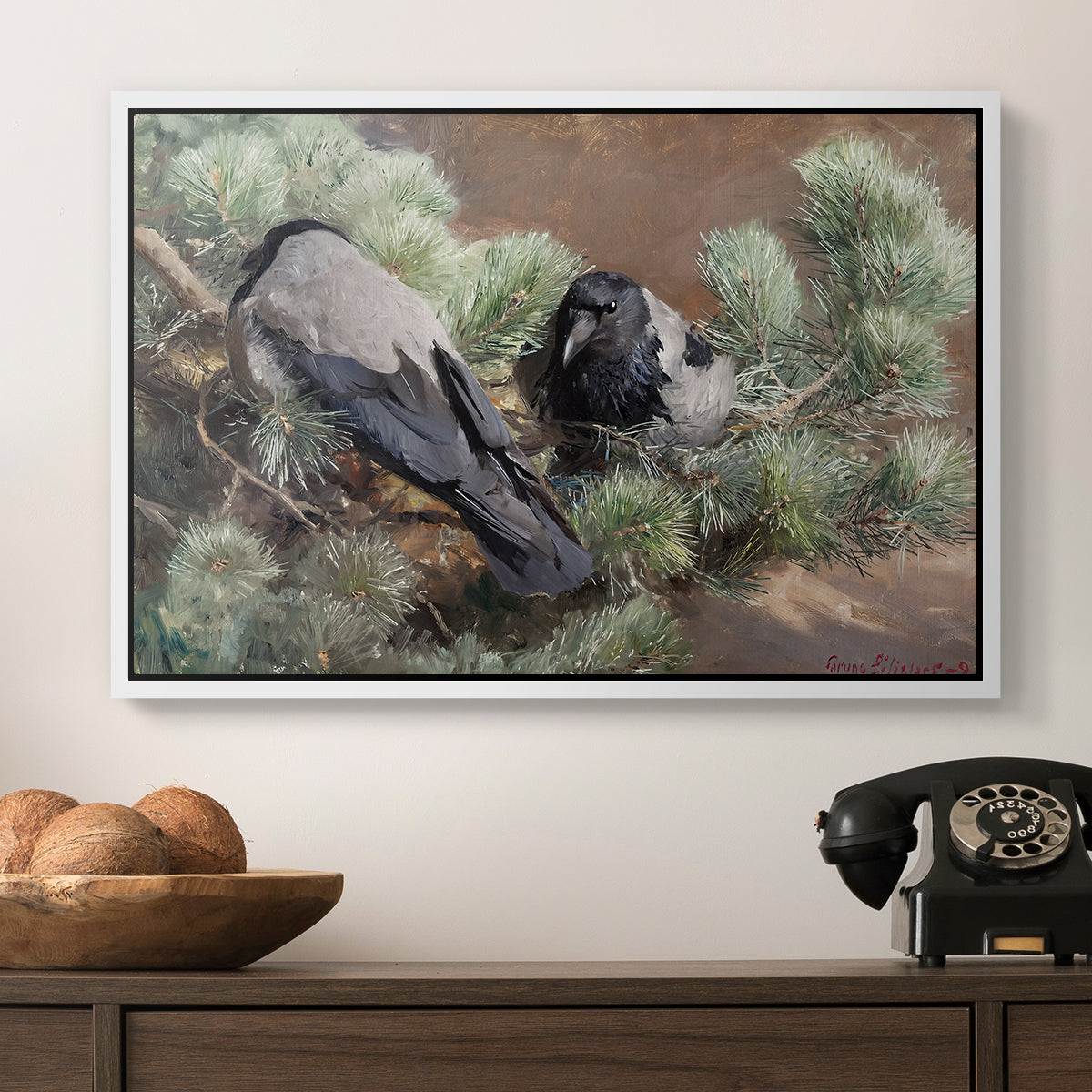 Hooded Crows (Kråkor), 1891 by Bruno Liljefors in a white floater framed canvas displayed above a console table in a hallway, featuring a wildlife painting of dark birds against muted landscape.