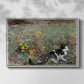 Front view of Cat on a Flowery Meadow, 1887 by Bruno Liljefors in a white floater framed canvas.