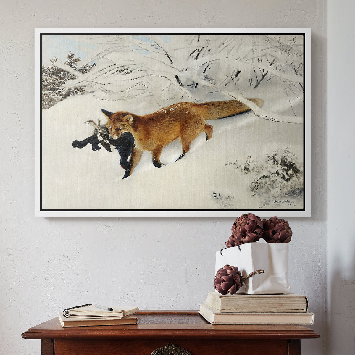 White floater framed canvas featuring Fox in Snow Landscape, 1900 by Bruno Liljefors above an entryway table in a minimalist foyer.