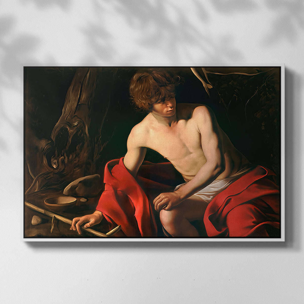 Front view of Saint John the Baptist in the Wilderness, c. 1603-1604 by Caravaggio in a white floater framed canvas.