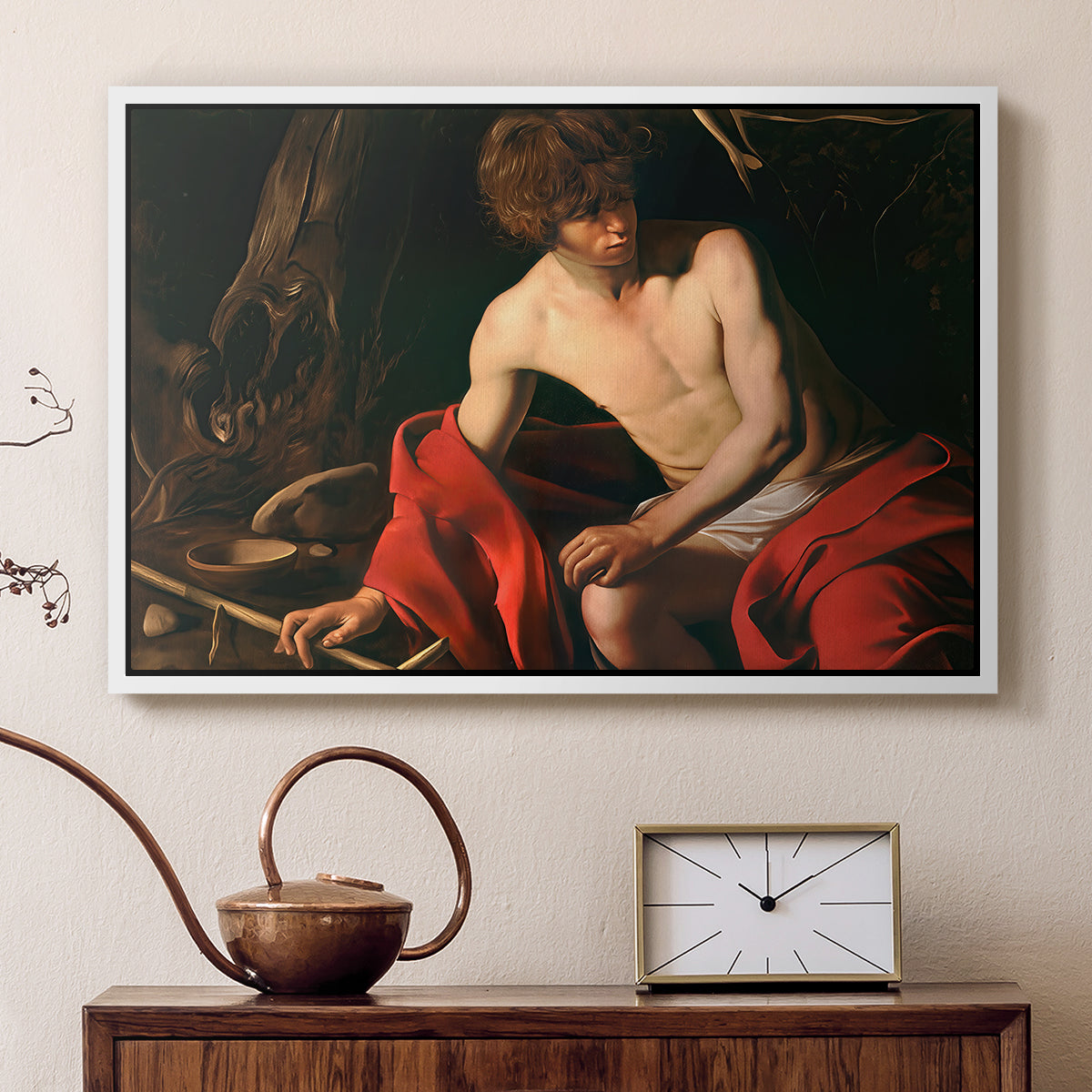 White floater framed canvas featuring a biblical youth seated outdoors with symbolic staff and minimal landscape, displayed above a cabinet in a soft-toned living room.