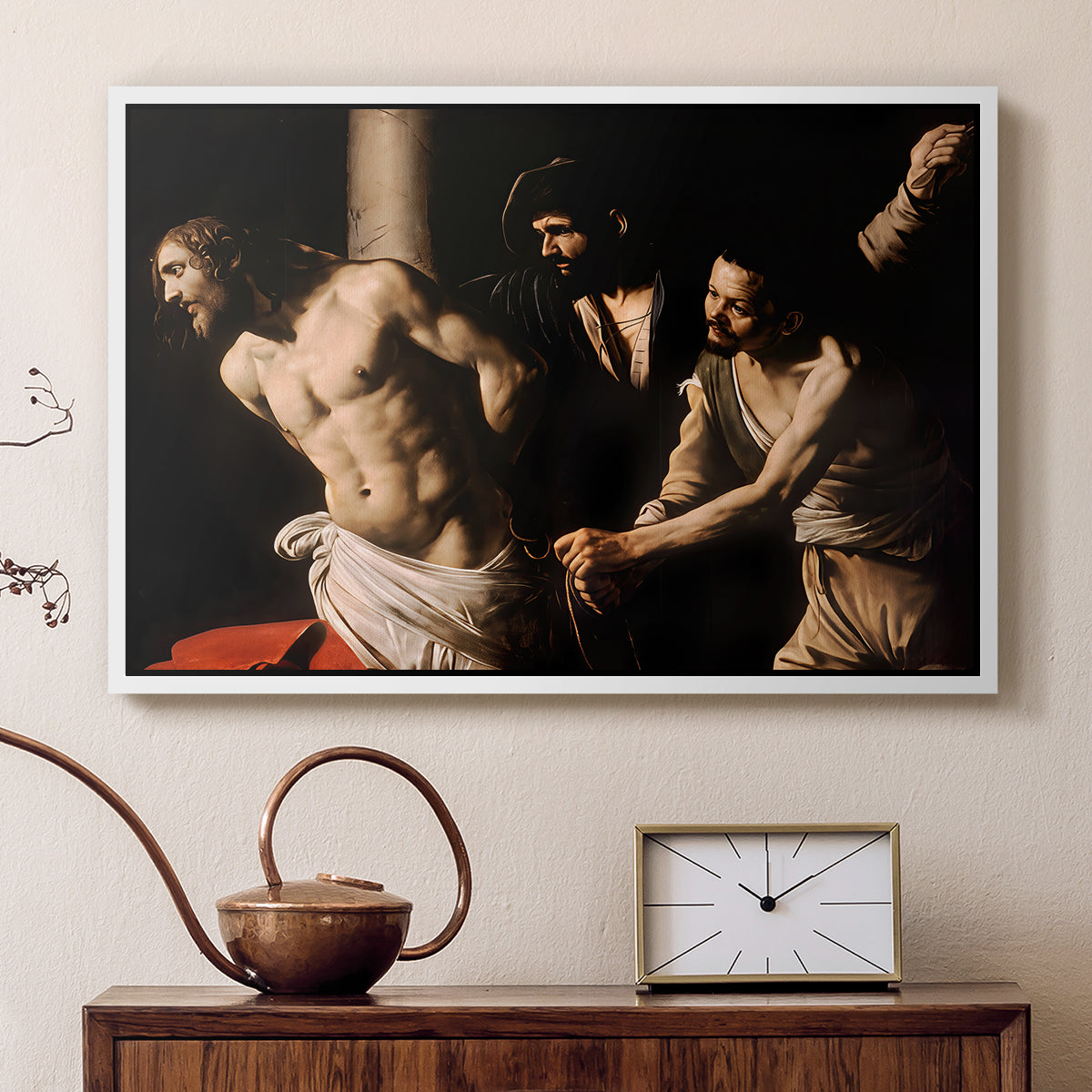 White floater framed canvas featuring a biblical depiction of men whipping Christ tied to pillar, displayed above a cabinet in a soft-toned living room.