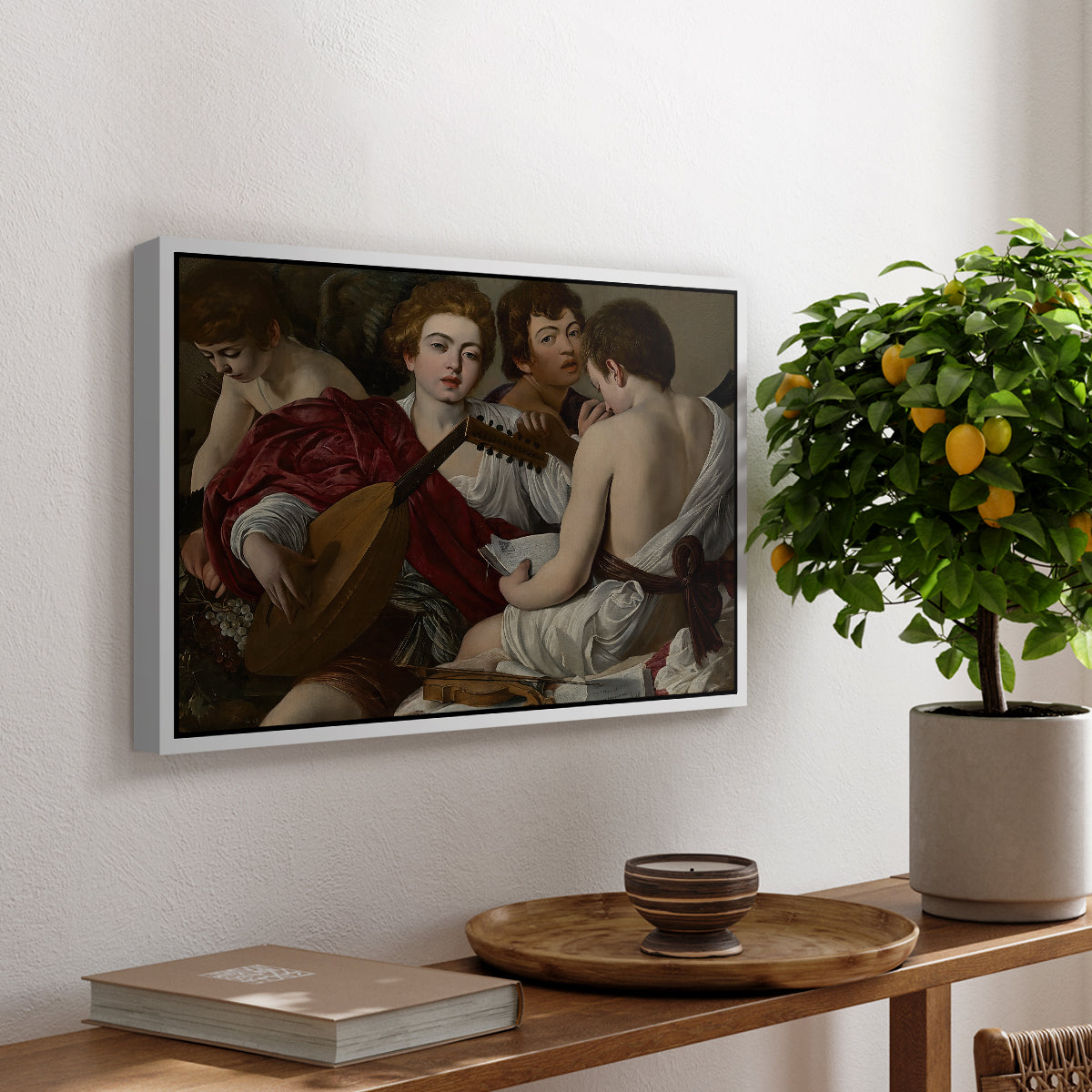 The Musicians, c. 1595 by Caravaggio, presented in a white floater framed canvas featuring a group of young men gathered together playing music with instruments, displayed above a hallway console table.