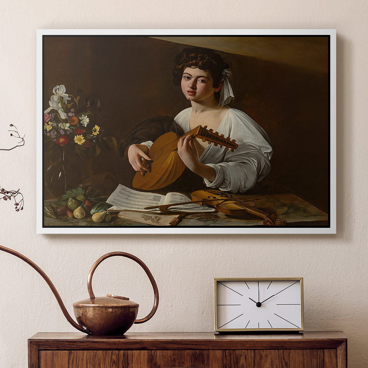 White floater framed canvas featuring an intimate musical scene with instrument and decorative objects, displayed above a cabinet in a soft-toned living room.