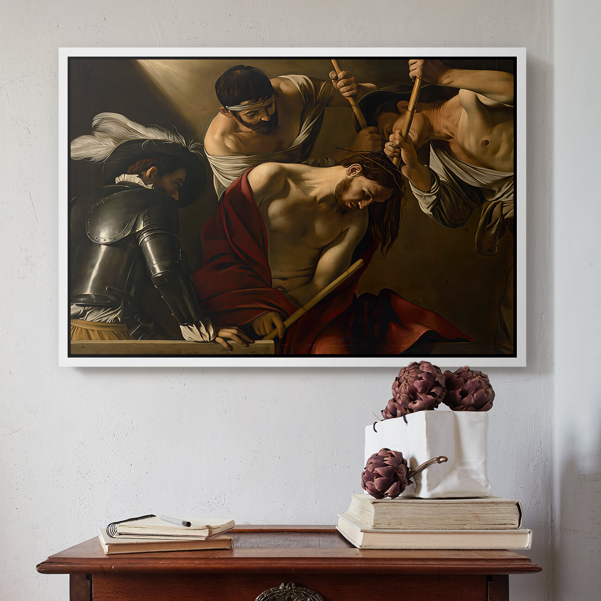 White floater framed canvas featuring The Crowning with Thorns (Vienna Version), c. 1602-1604 by Caravaggio above an entryway table in a minimalist foyer.