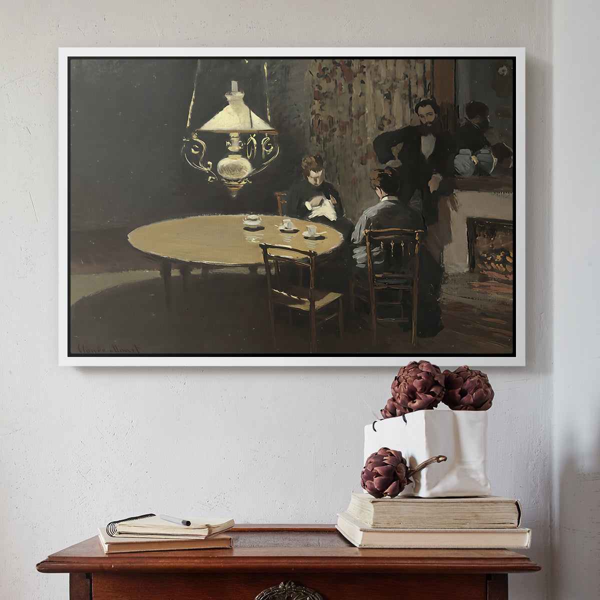 White floater framed canvas featuring Interior, after Dinner, 1868-1869 by Claude Monet above an entryway table in a minimalist foyer.