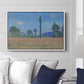 Poppy Field (Giverny), 1890-1891 by Claude Monet displayed above a sofa in a living room in a white floater frame, featuring an impressionist landscape of blooming poppies in countryside.