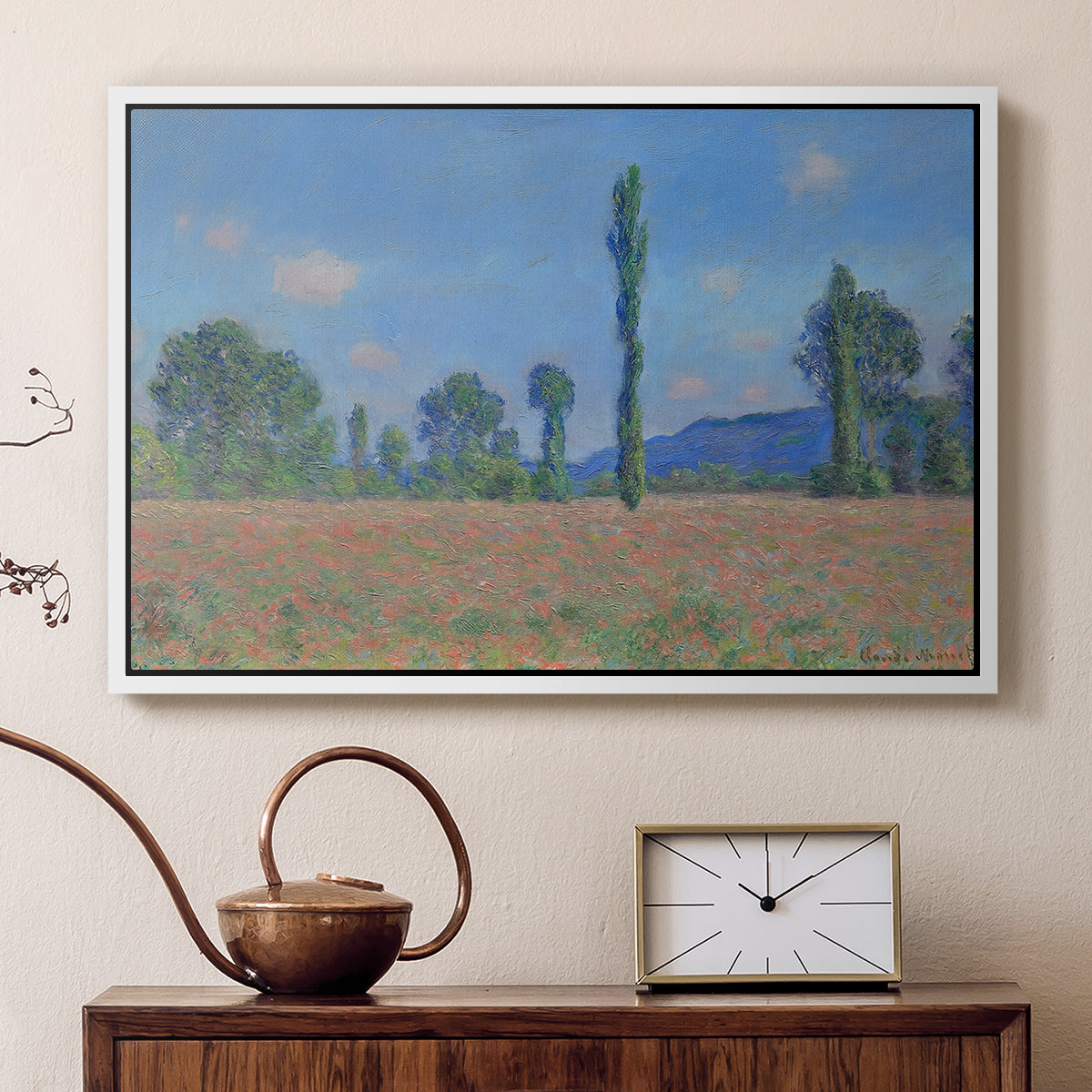 White floater framed canvas featuring a vibrant meadow scene with flowers and vertical tree forms, displayed above a cabinet in a soft-toned living room.