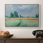The Wheat Field (Champ de Blé), 1881 by Claude Monet in a white floater framed canvas displayed above a console table in a hallway, featuring a serene rural scene with textured wheat under natural light.