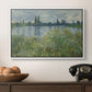 Banks of the Seine, Vétheuil, 1880 by Claude Monet in a white floater framed canvas displayed above a console table in a hallway, featuring a natural landscape with calm water and soft foliage.