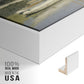 Close-up of the white floater frame corner and gallery wrapped canvas construction.