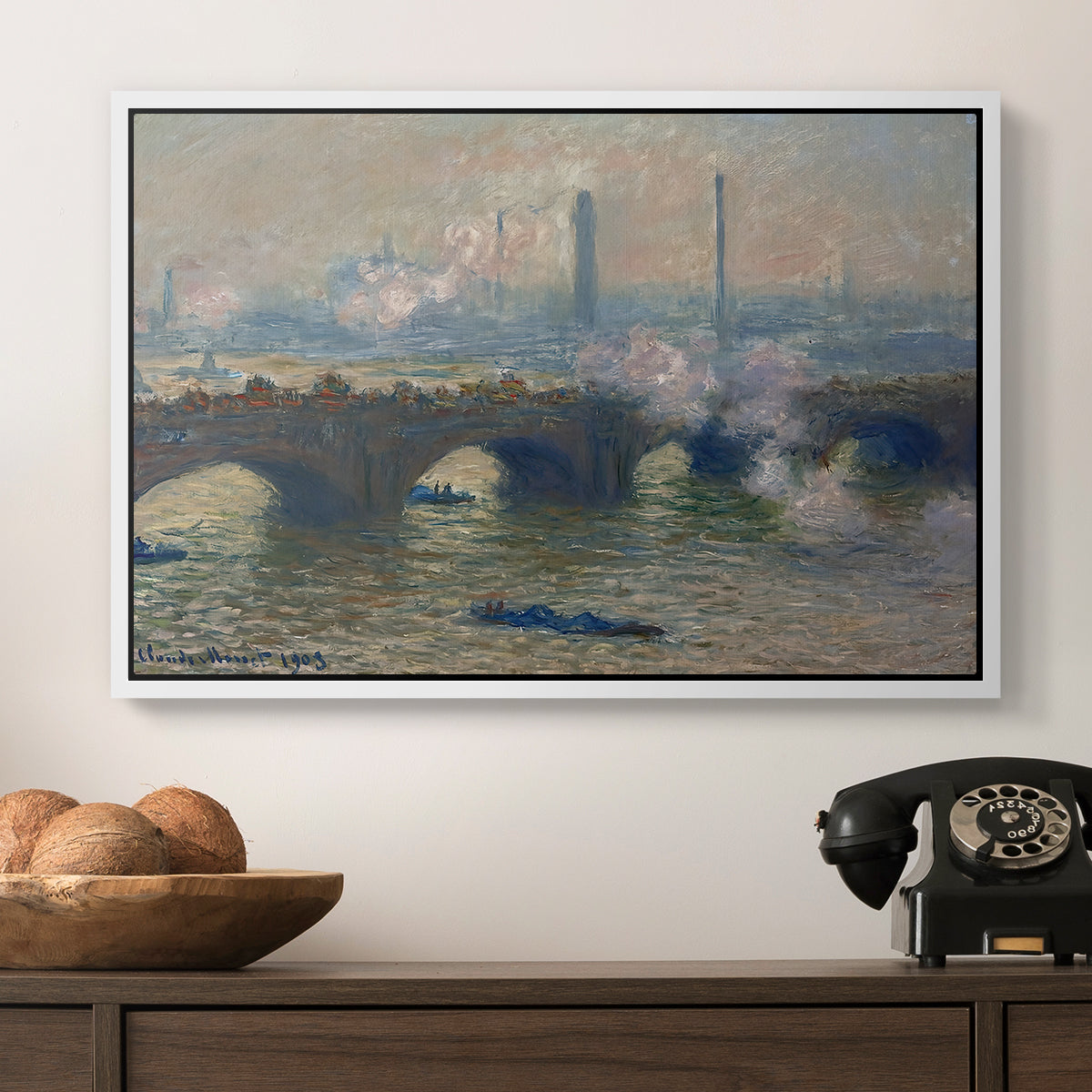 Waterloo Bridge, Gray Day, 1903 by Claude Monet in a white floater framed canvas displayed above a console table in a hallway, featuring a foggy London bridge view with softened architectural forms.