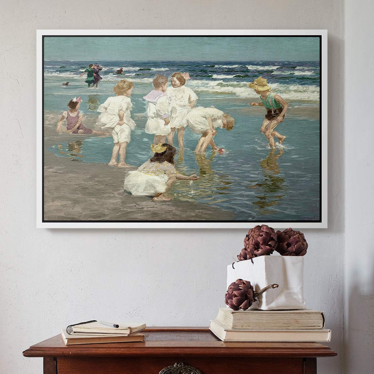 White floater framed canvas featuring A Holiday, c. 1915 by Edward Henry Potthast above an entryway table in a minimalist foyer.