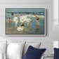 A Holiday, c. 1915 by Edward Henry Potthast displayed above a sofa in a living room in a white floater frame, featuring a beach scene with figures bathing and standing in waves under bright sky.