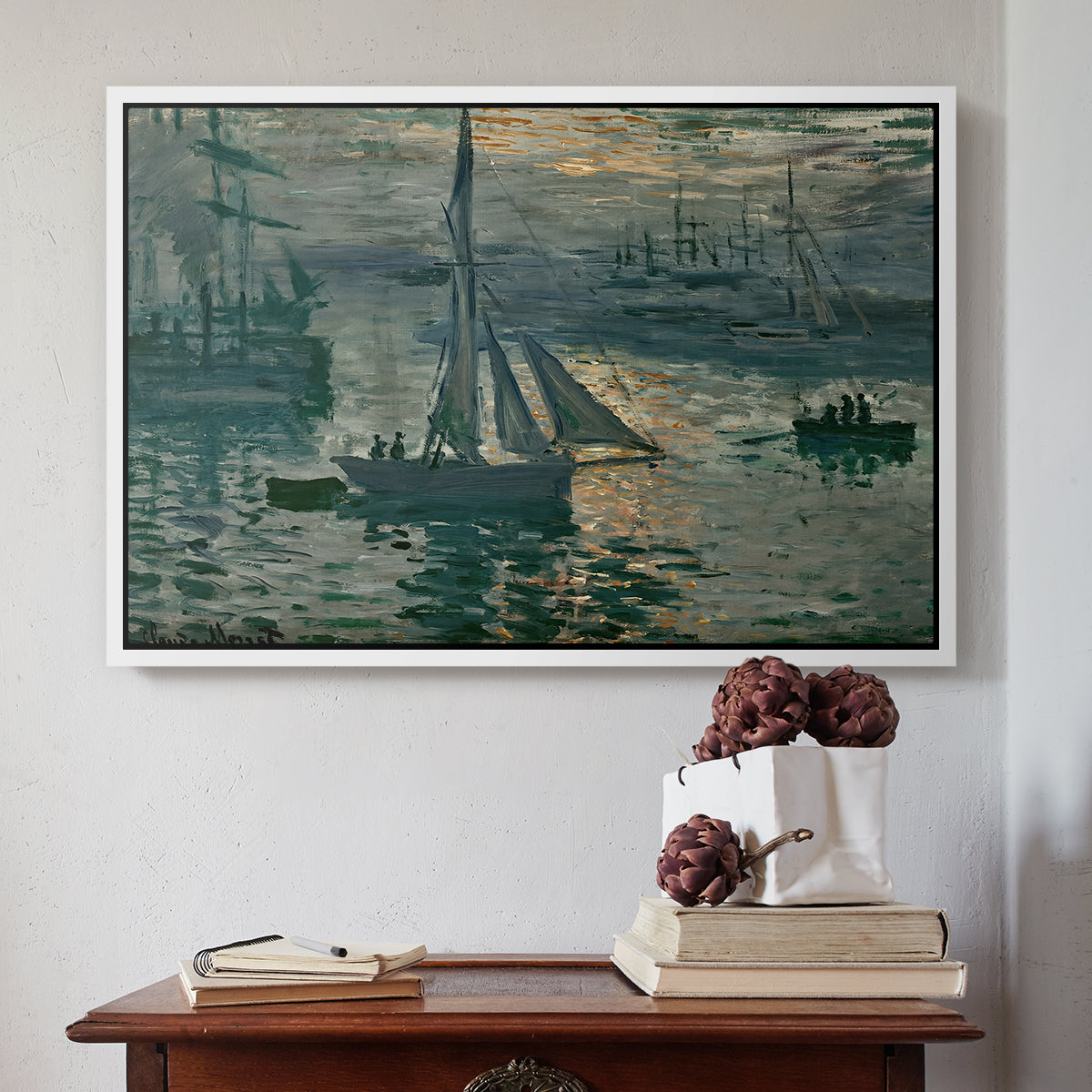 White floater framed canvas featuring Sunrise (Marine), 1873 by Claude Monet above an entryway table in a minimalist foyer.