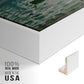 Close-up of the white floater frame corner and gallery wrapped canvas construction.