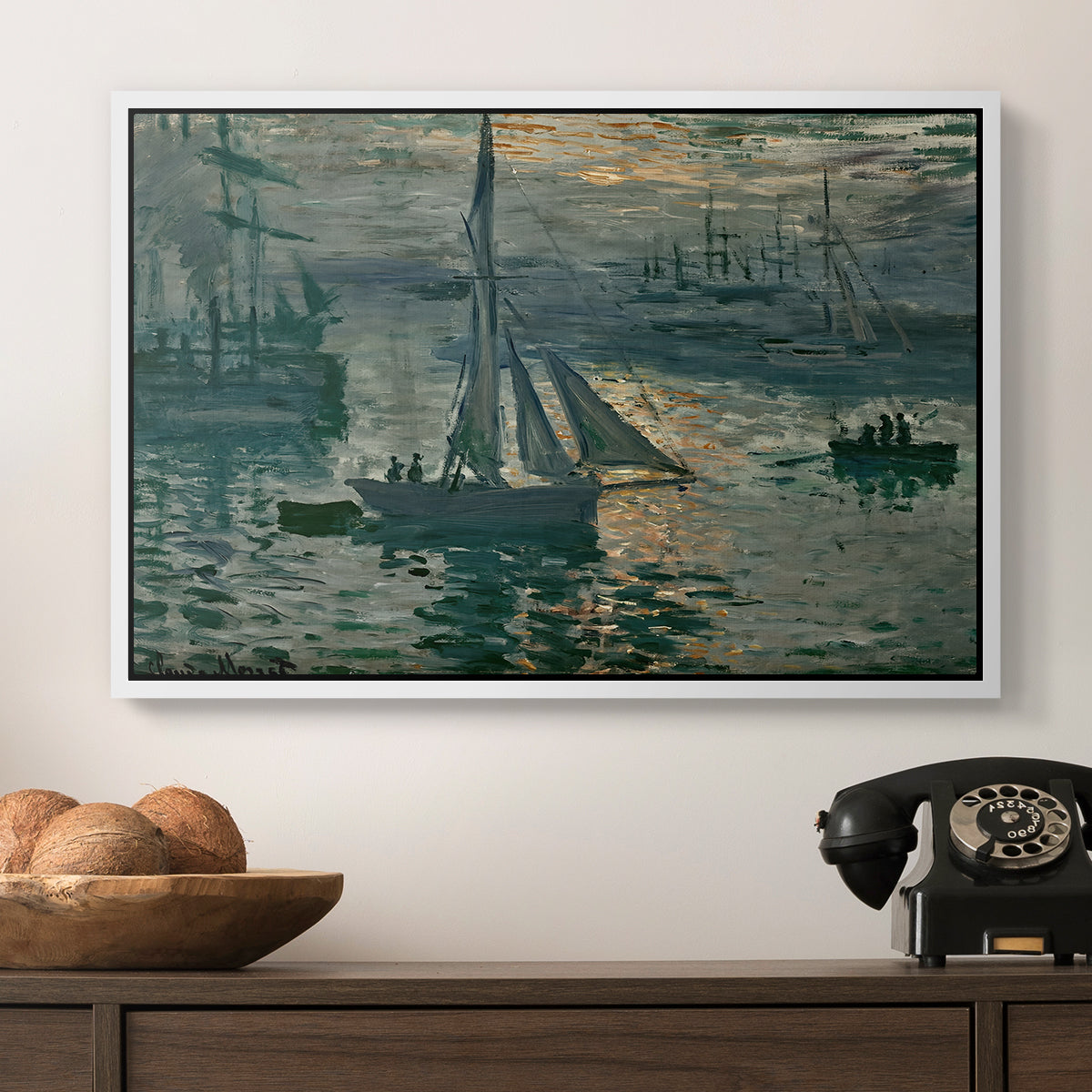 Sunrise (Marine), 1873 by Claude Monet in a white floater framed canvas displayed above a console table in a hallway, featuring an atmospheric ocean view with sun rising through haze.