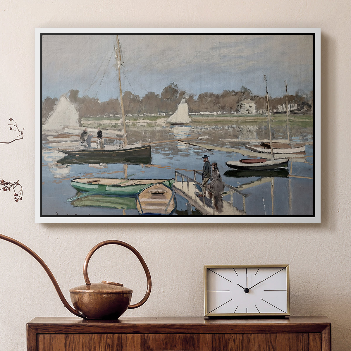 White floater framed canvas featuring a harbor basin filled with boats under soft sky, displayed above a cabinet in a soft-toned living room.