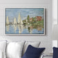 Regatta at Argenteuil, 1872 by Claude Monet displayed above a sofa in a living room in a white floater frame, featuring a lively regatta scene with multiple boats and fluttering sails.