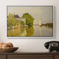 Houses on the Achterzaan, 1871 by Claude Monet in a white floater framed canvas displayed above a console table in a hallway, featuring a peaceful village scene with houses bordering water.