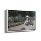 Angled view of Young Girl in the Garden at Giverny, 1888 by Claude Monet in a white floater framed canvas.