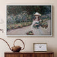 White floater framed canvas featuring a figure resting in colorful garden under soft light, displayed above a cabinet in a soft-toned living room.