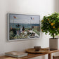 Garden at Sainte-Adresse, 1867 by Claude Monet, presented in a white floater framed canvas featuring a seaside garden with flowers, flags, and figures overlooking the water, displayed above a hallway console table.