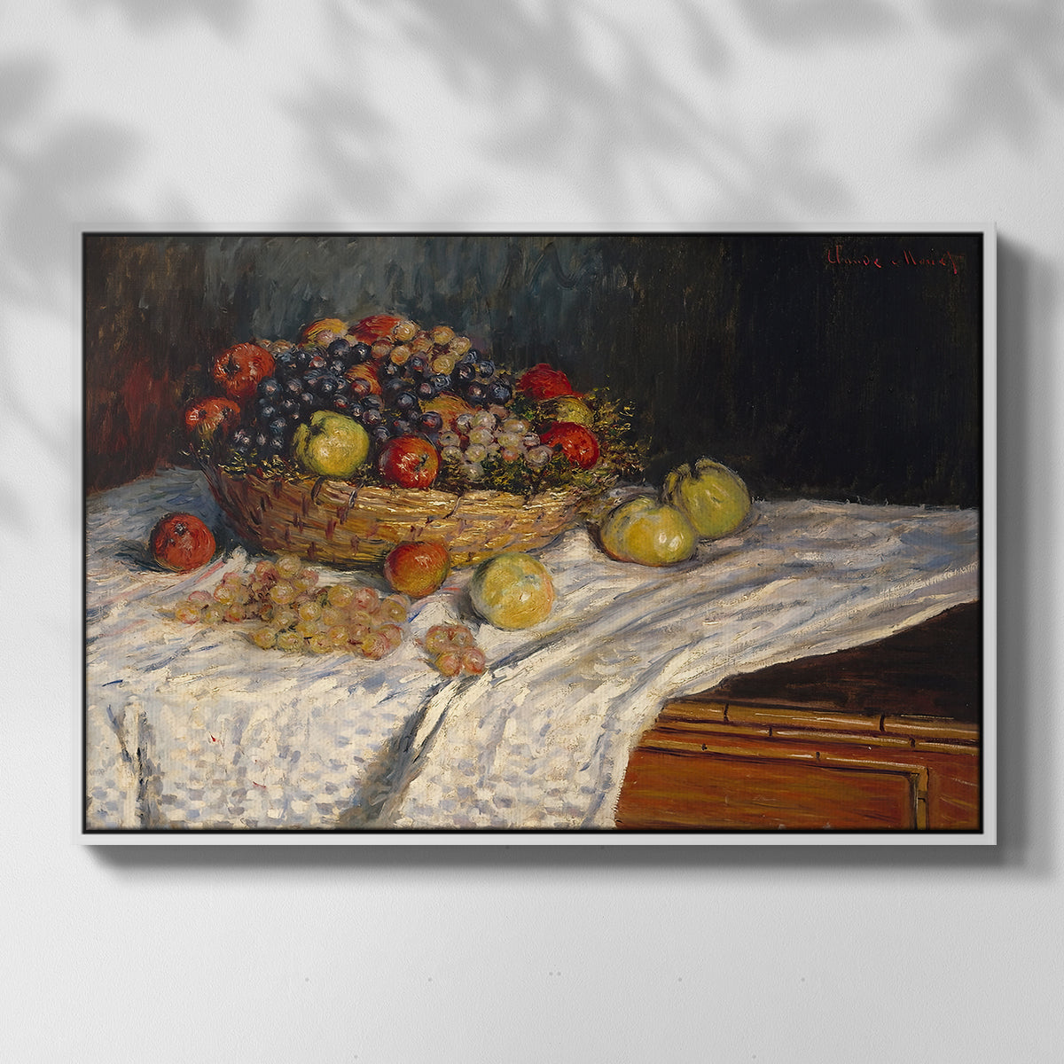Front view of Still Life with Apples and Grapes, 1880 by Claude Monet in a white floater framed canvas.