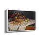 Angled view of Still Life with Apples and Grapes, 1880 by Claude Monet in a white floater framed canvas.