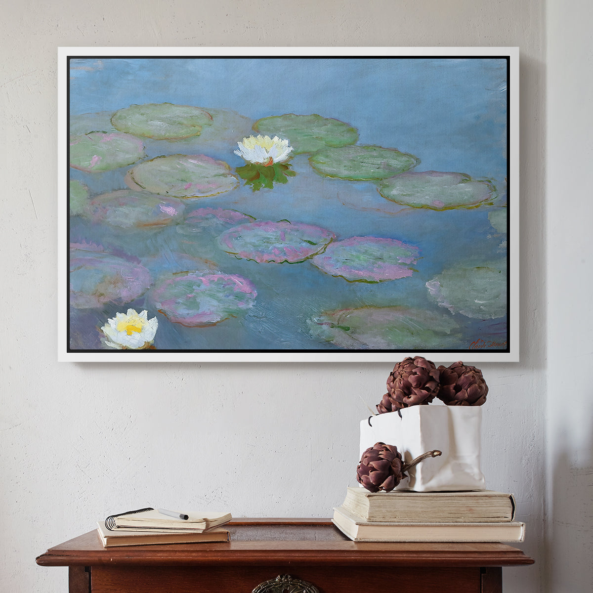 White floater framed canvas featuring Water Lilies (Nymphéas), 1897-1899 by Claude Monet above an entryway table in a minimalist foyer.