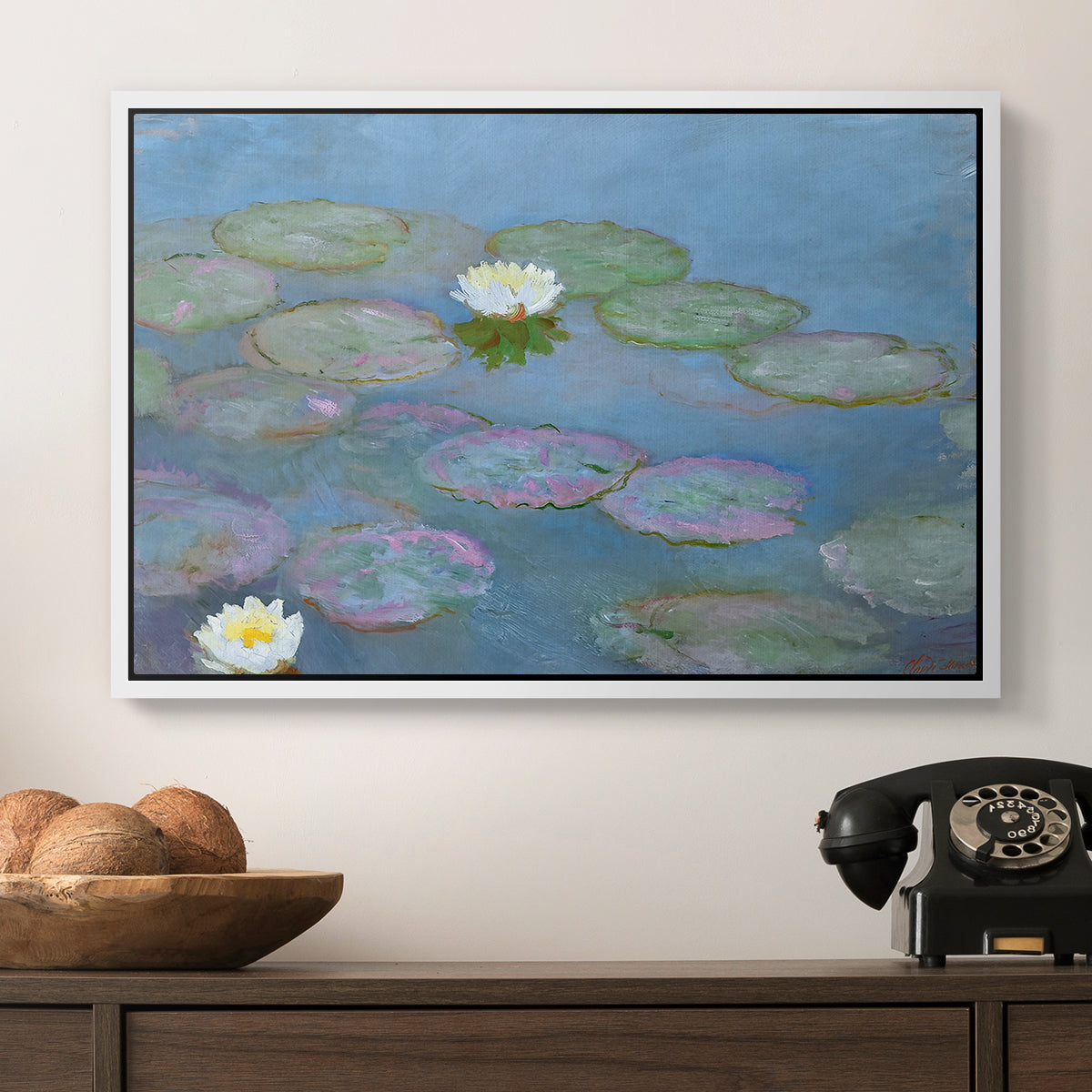 Water Lilies (Nymphéas), 1897-1899 by Claude Monet in a white floater framed canvas displayed above a console table in a hallway, featuring a close-up of aquatic plants in still water.