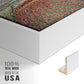 Close-up of the white floater frame corner and gallery wrapped canvas construction.