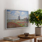 Tulip Fields with the Rijnsburg Windmill, 1886 by Claude Monet, presented in a white floater framed canvas featuring colorful rows of tulip fields leading toward distant windmill, displayed above a hallway console table.