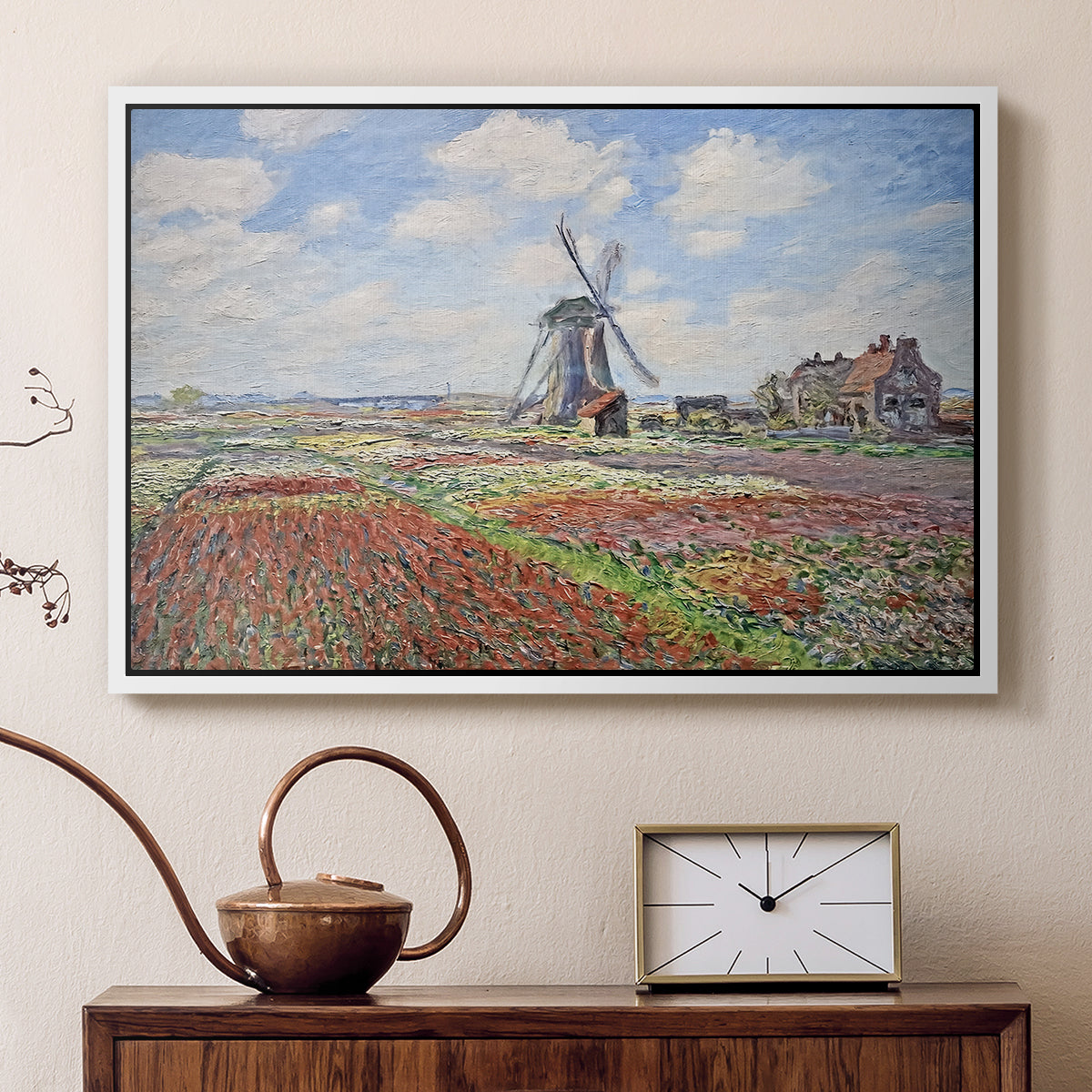 White floater framed canvas featuring an impressionist field of blooming tulips under bright sky, displayed above a cabinet in a soft-toned living room.