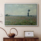 White floater framed canvas featuring a rural meadow with scattered poppies and soft horizon, displayed above a cabinet in a soft-toned living room.