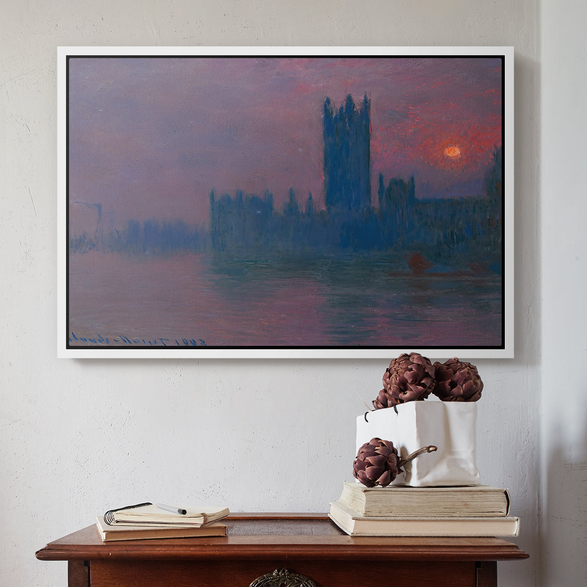White floater framed canvas featuring The Houses of Parliament, Sunset, 1903 by Claude Monet above an entryway table in a minimalist foyer.