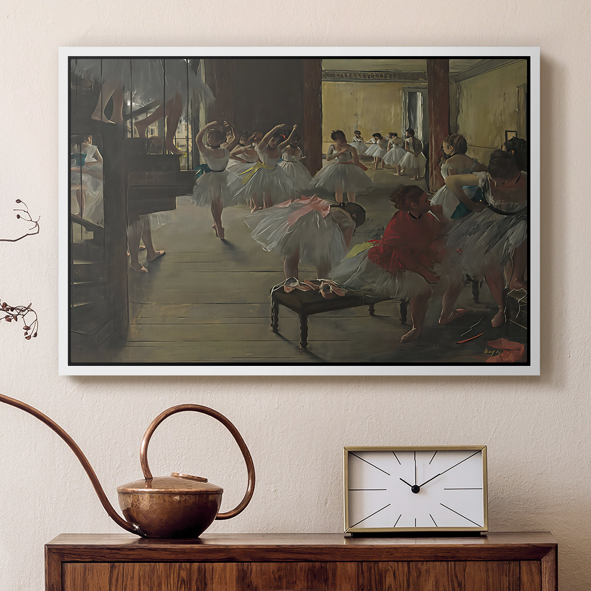 White floater framed canvas featuring an impressionist studio interior filled with ballet students, displayed above a cabinet in a soft-toned living room.