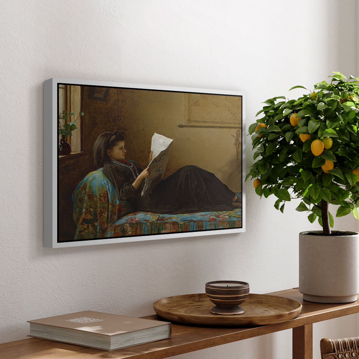 Interesting News, 1872 by Eastman Johnson, presented in a white floater framed canvas featuring a group of people gathered indoors reading newspaper together, displayed above a hallway console table.
