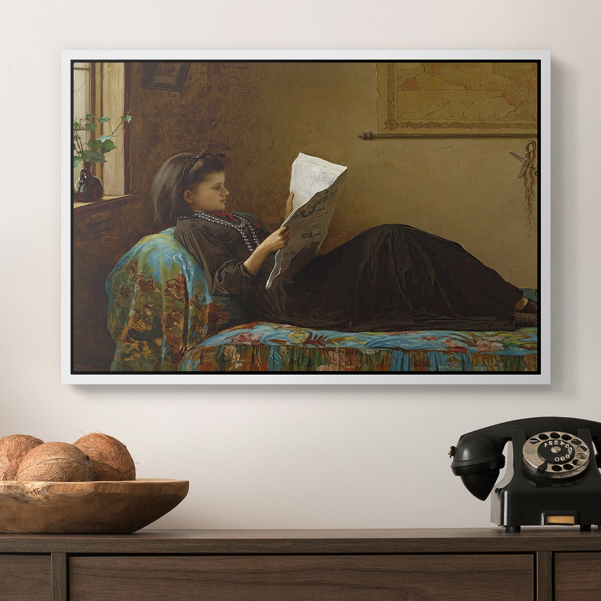 Interesting News, 1872 by Eastman Johnson in a white floater framed canvas displayed above a console table in a hallway, featuring a casual gathering around newspaper in rustic room.