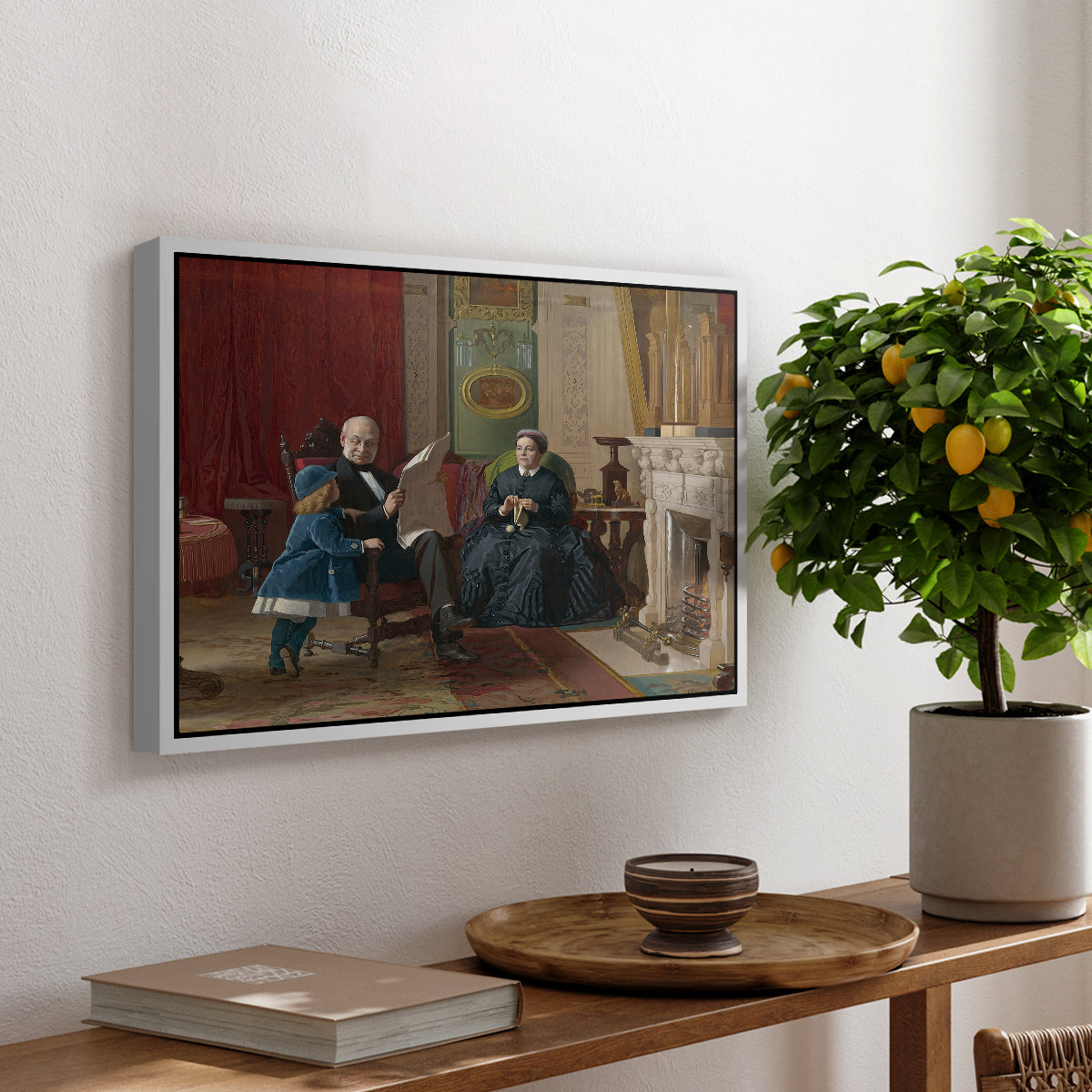 The Brown Family, 1869 by Eastman Johnson, presented in a white floater framed canvas featuring a family seated together in interior room engaged in quiet activity, displayed above a hallway console table.